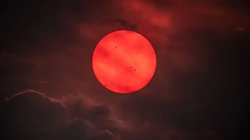 Red Sun Through Wildfire Smoke: NASA's APOD Shows an Eerie Solar View