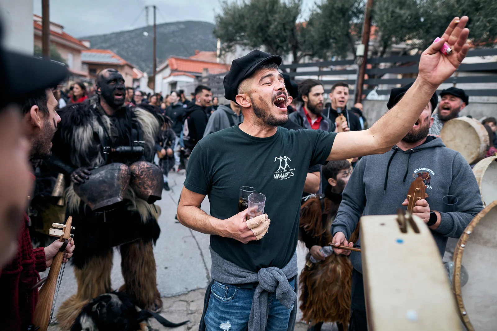 Musicians and participants sing in the streets of Petrousa