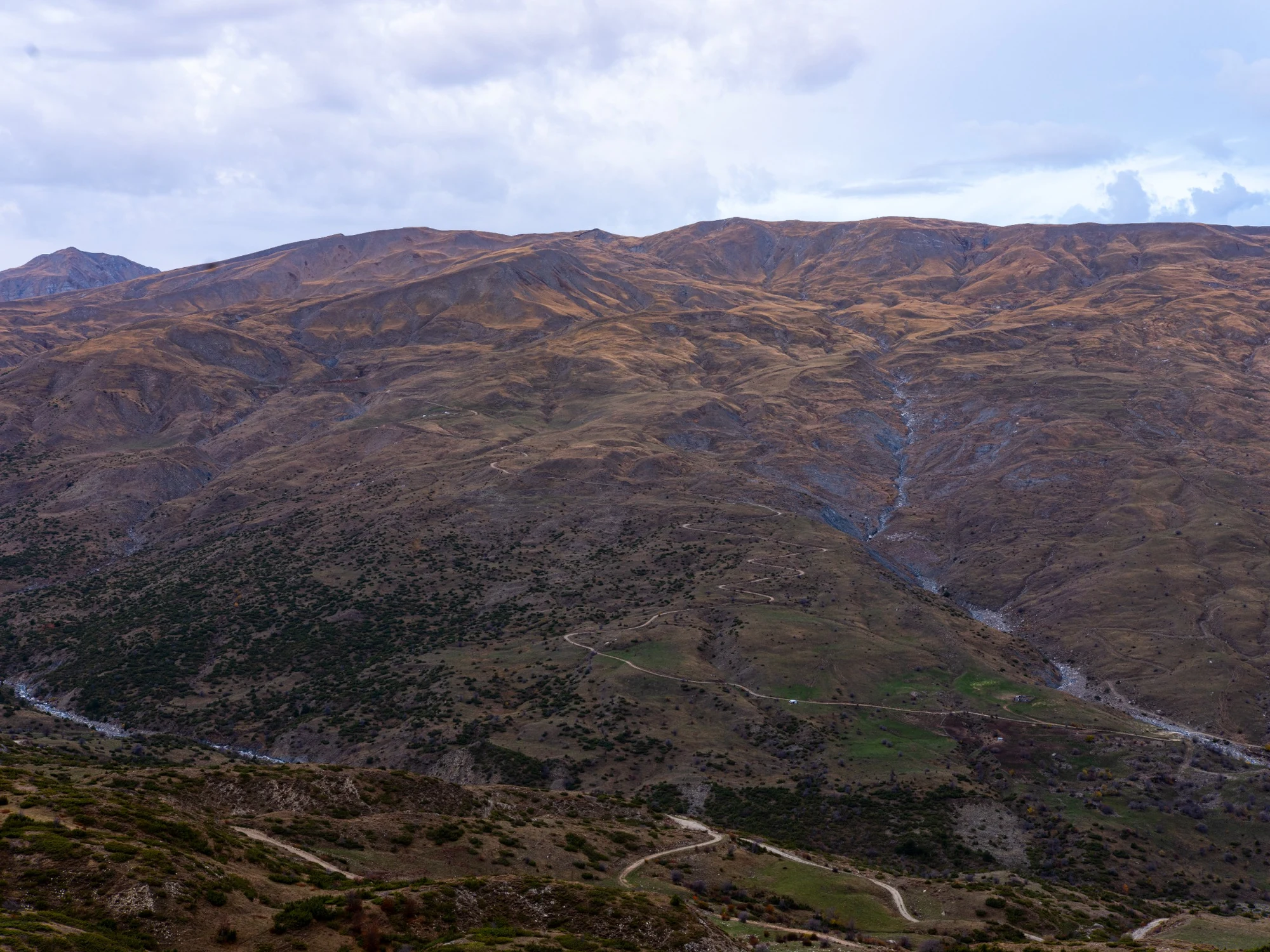 Mountain autumn landscape with a winding road