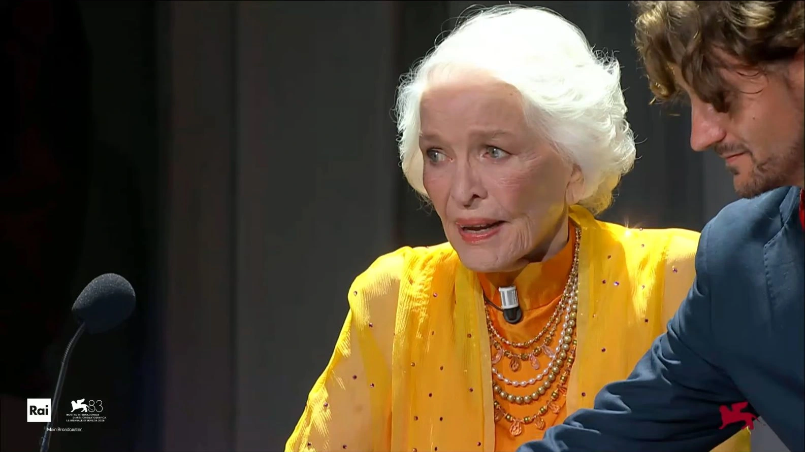 An emotional Ellen Burstyn at the microphone during her award ceremony in Venice.