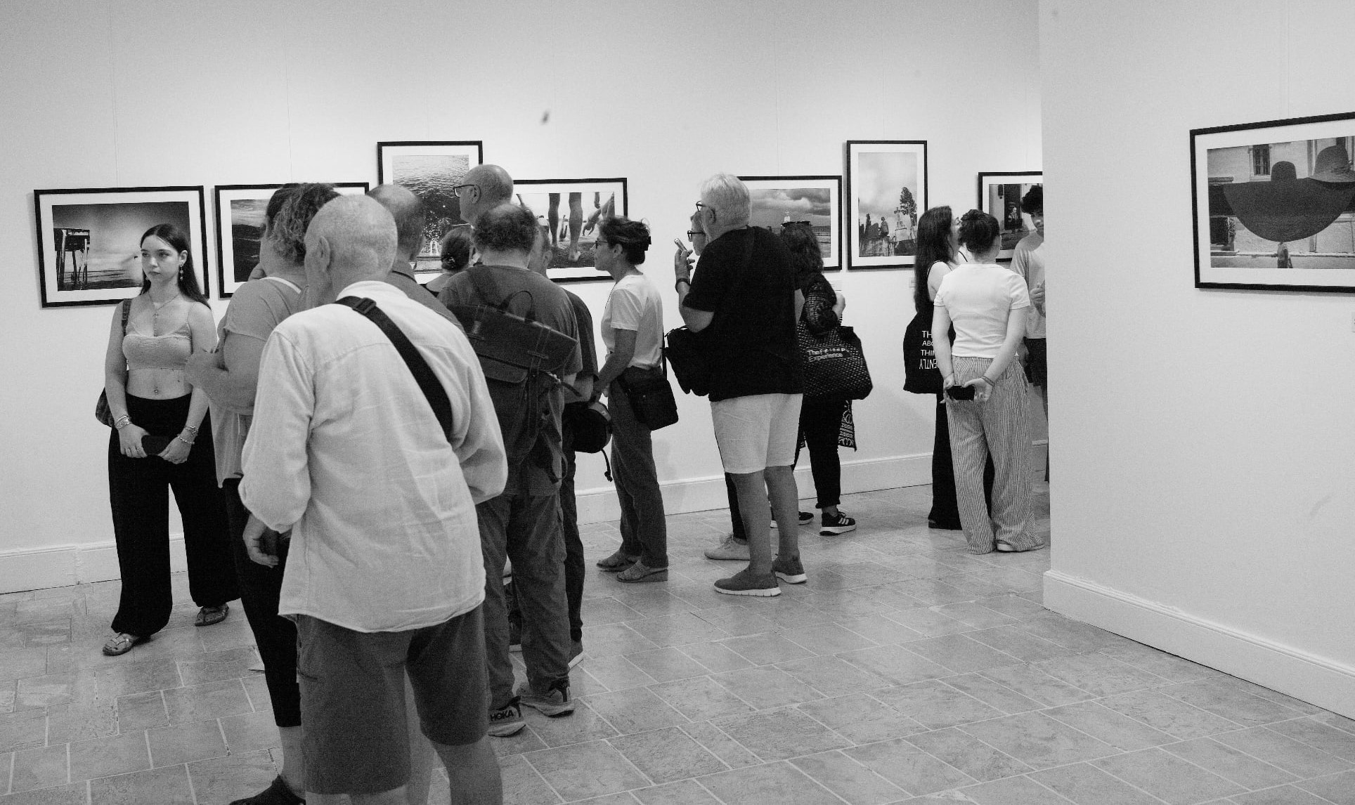 Visitors viewing photographs at the “My City” exhibition
