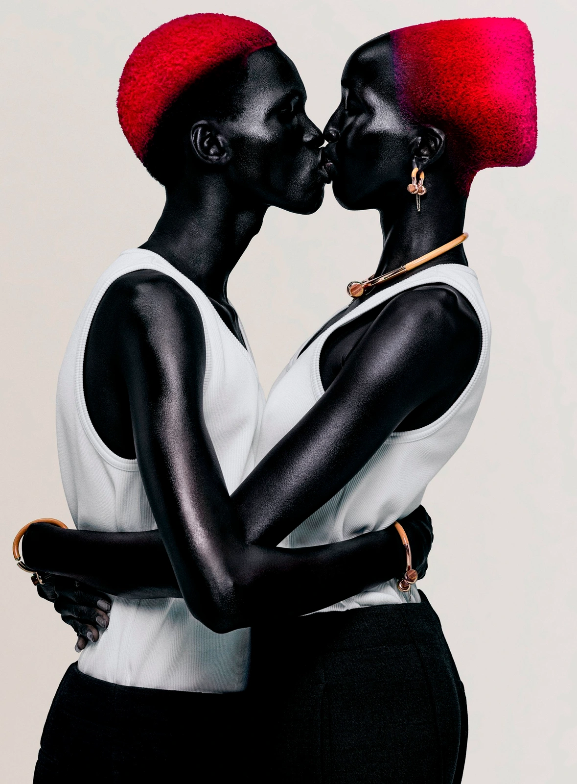 Nyaueth Riam and Mamuor Awak with red hair wearing Bottega Veneta, photographed by Rafael Pavarotti.