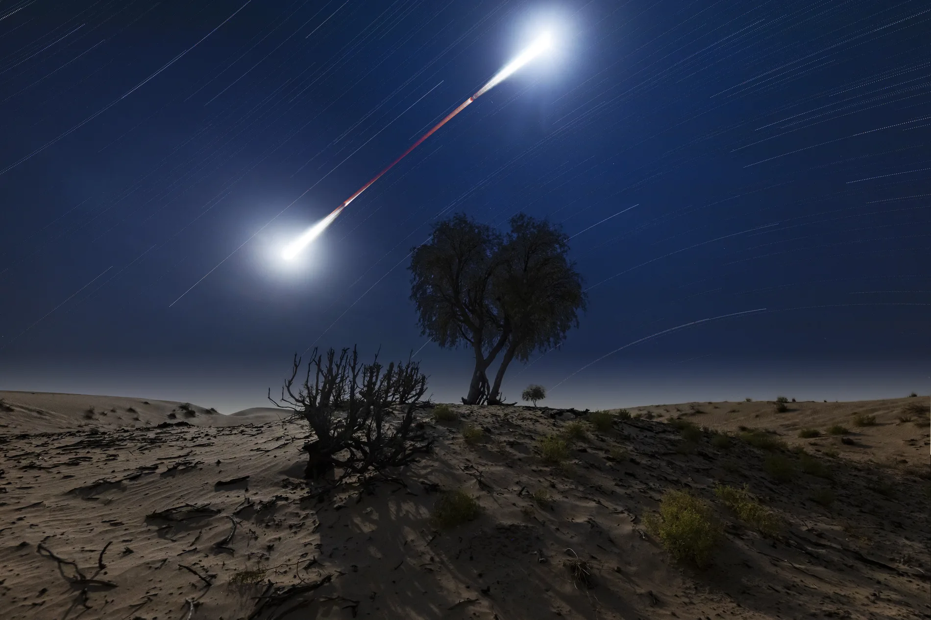 A total lunar eclipse above the dunes near Abu Dhabi — Apostolos Kyriazis