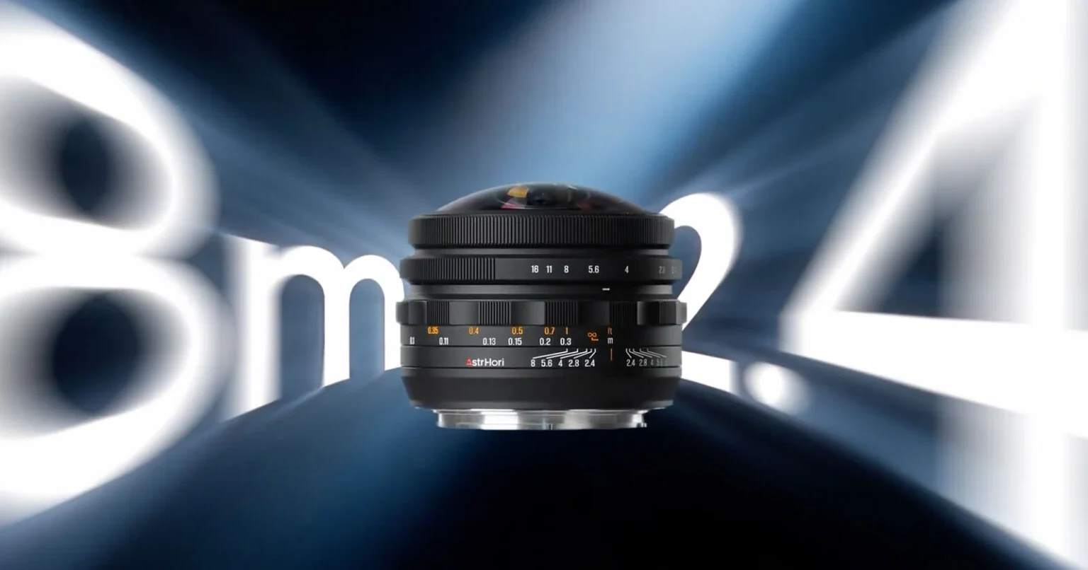 AstrHori 8mm f/2.4 fisheye held in a hand