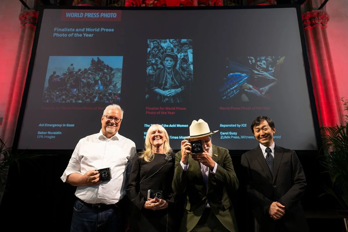 Four participants at a World Press Photo awards event