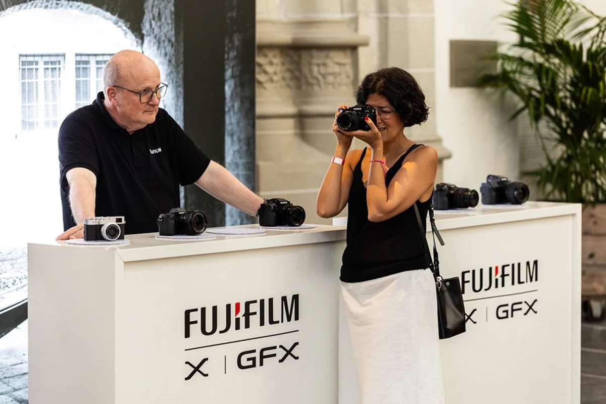 Visitor testing a Fujifilm camera at an event