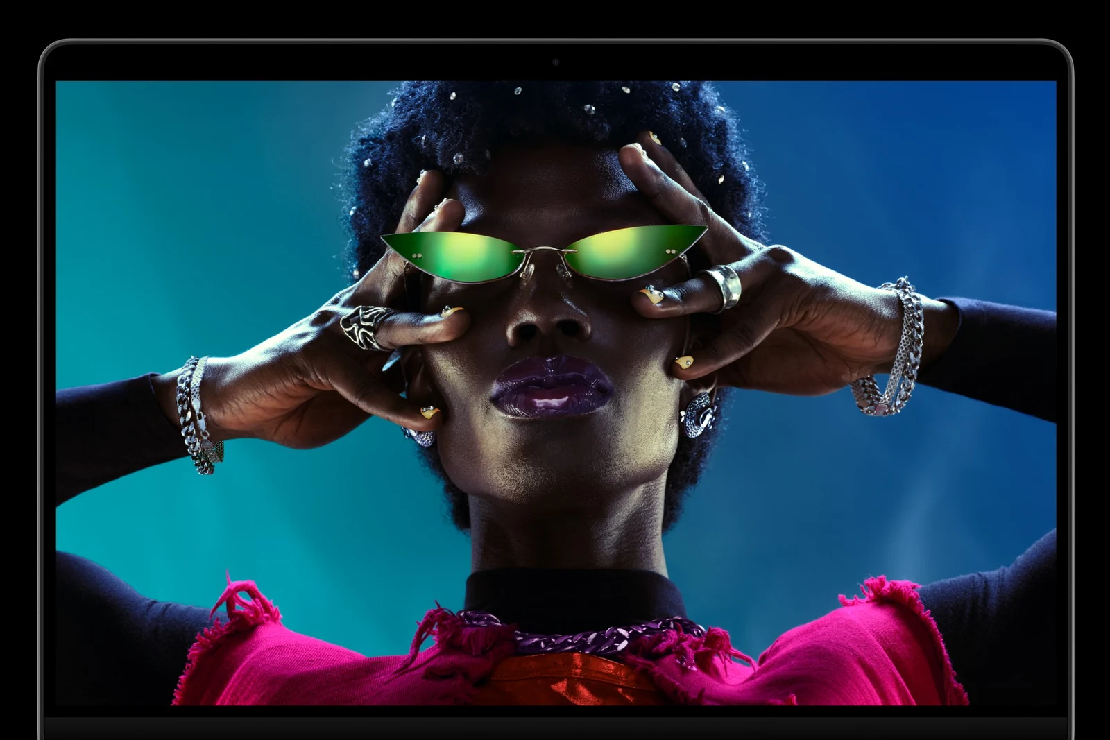 MacBook Pro with M6 showing a portrait on its Liquid Retina XDR display
